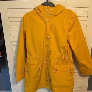 Rain coat mid length .